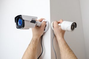 workers-installing-video-surveillance-cameras-walls